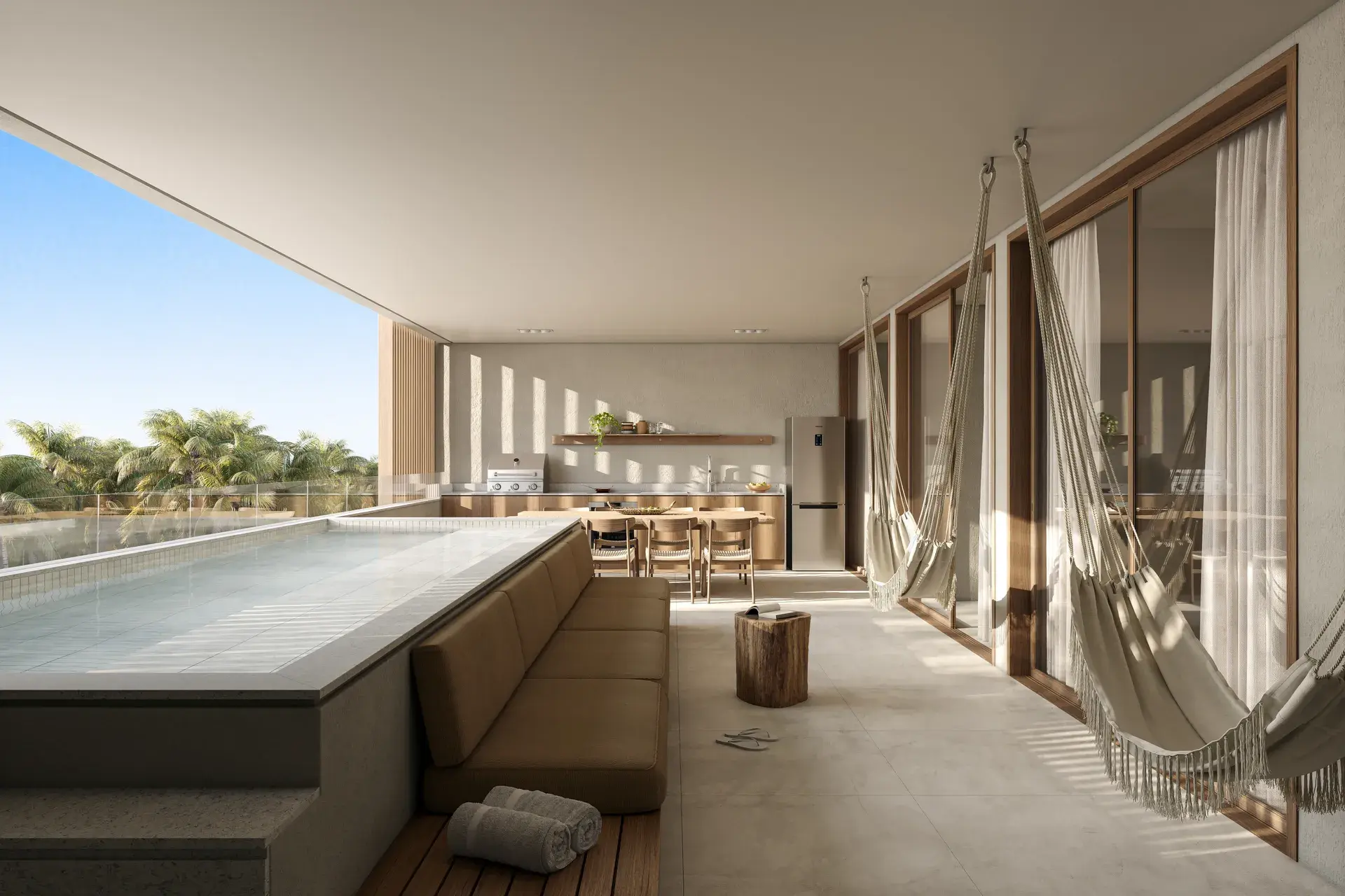 Furnished balcony with a bathtub, two hammocks, and a view of palm tree canopies